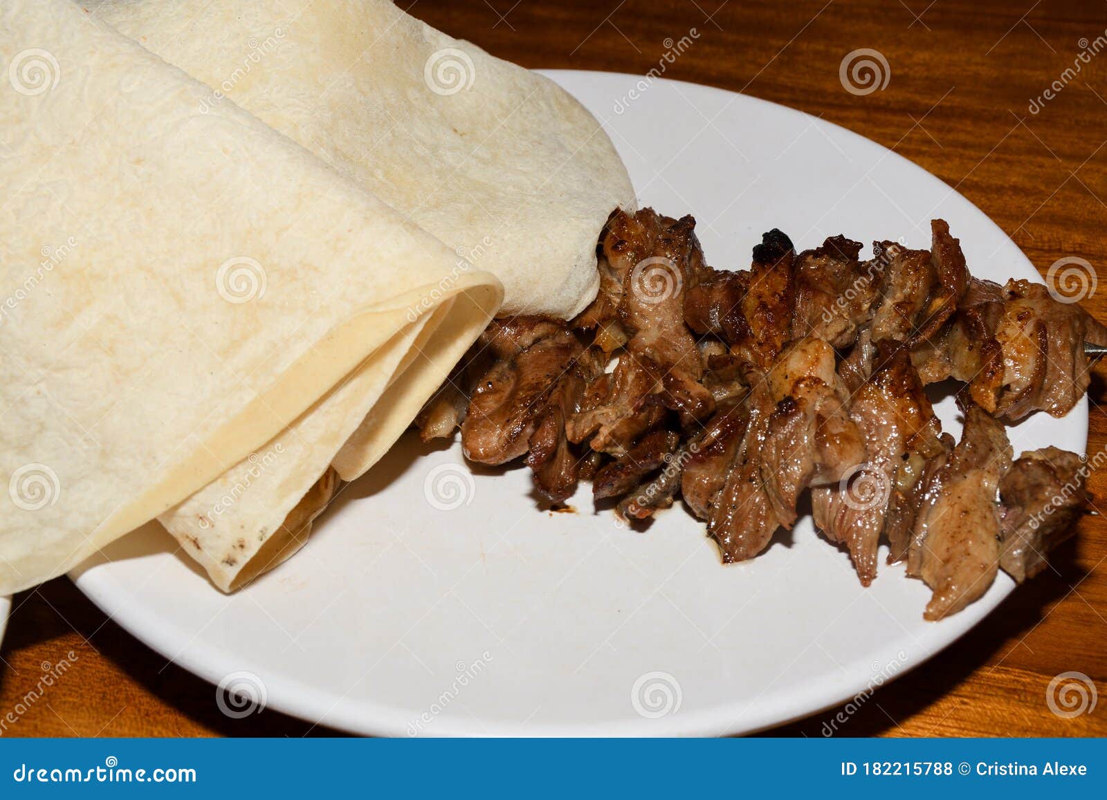 turkish cag kebab doner in wood fired oven named erzurum caÃÅ¸ kebabÃÂ± served at ÃÅ¾ehzade caÃÅ¸ kebap
